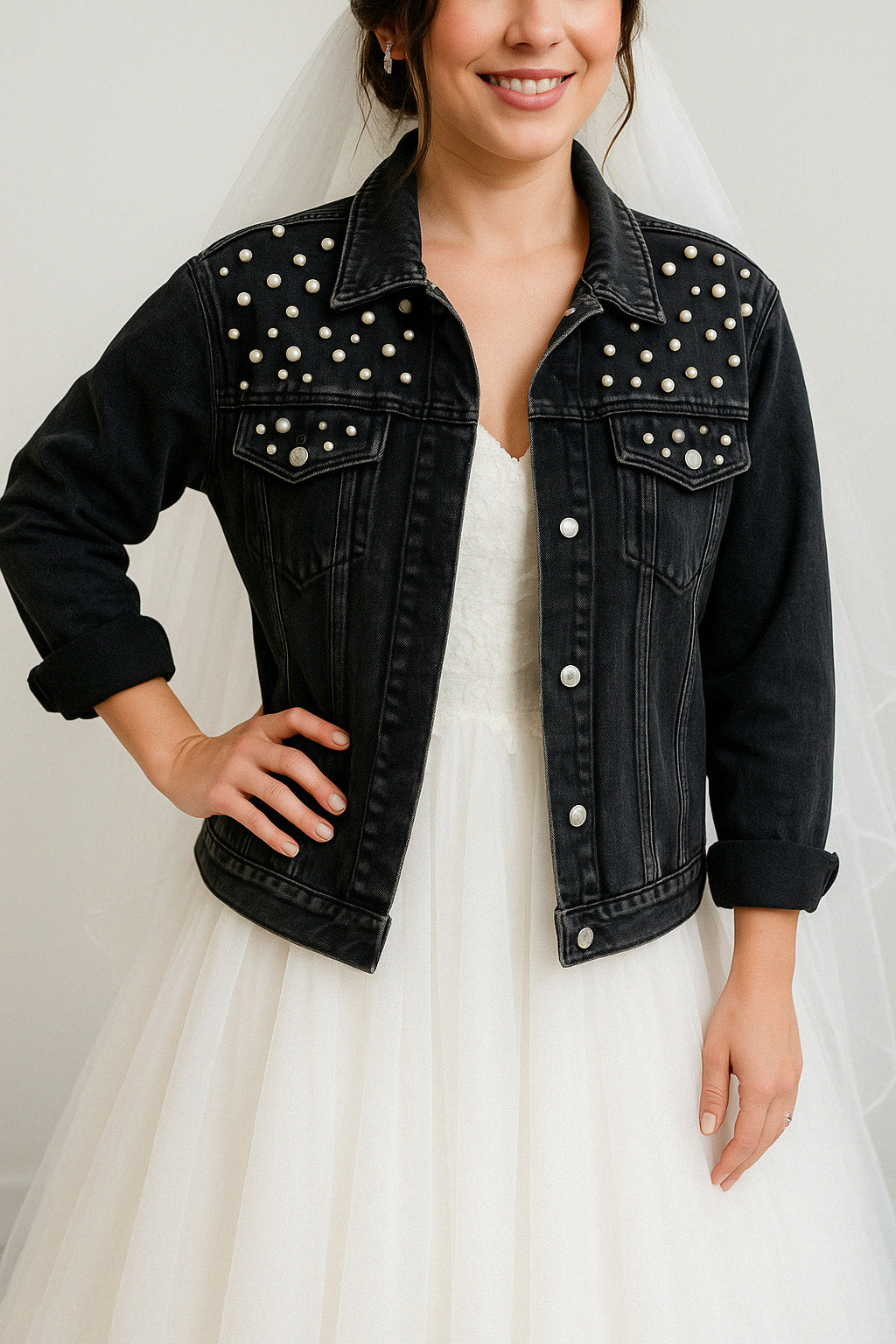 a woman wearing a wedding dress and a denim jacket