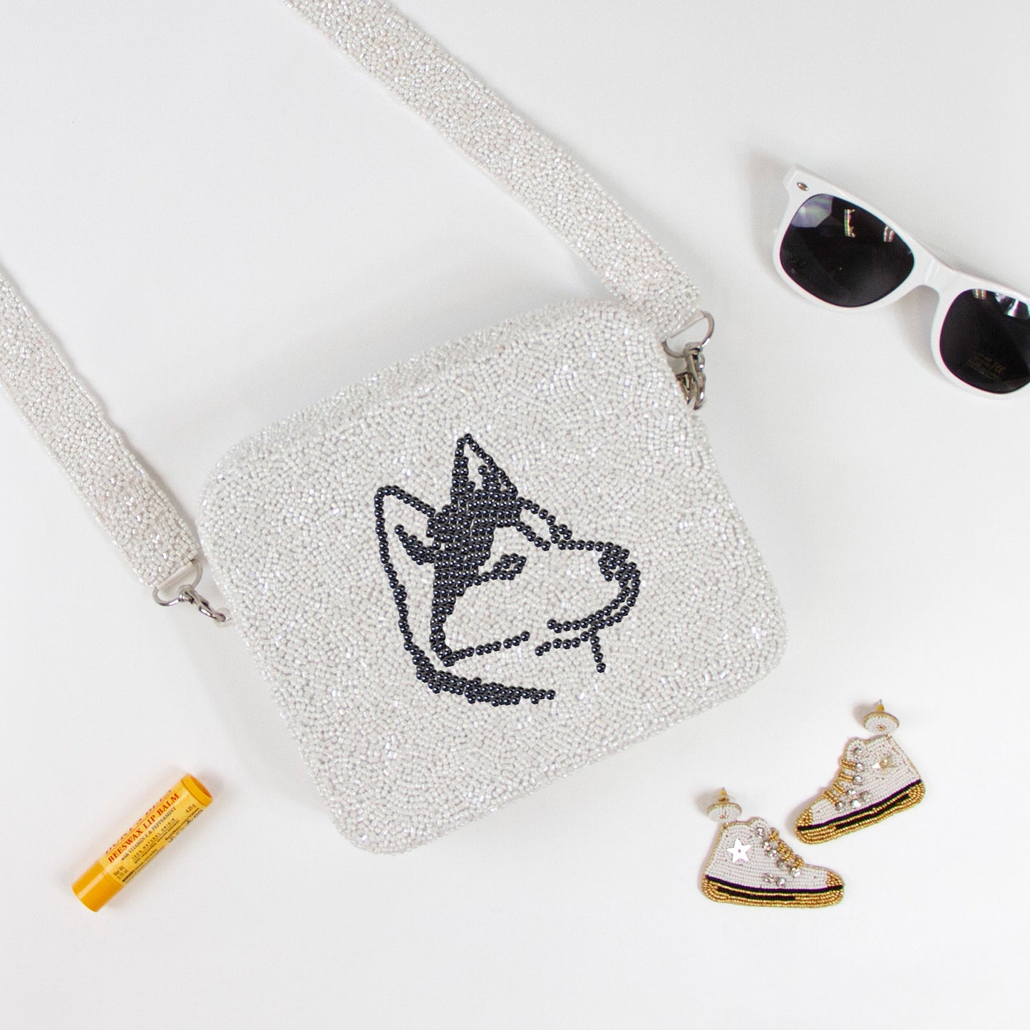 Customizable beaded crossbody bag with a unique design, perfect for summer outings. Features a removable 46-inch beaded strap and zipper closure. Handcrafted ensuring each piece's individuality in color, texture, and beadwork.