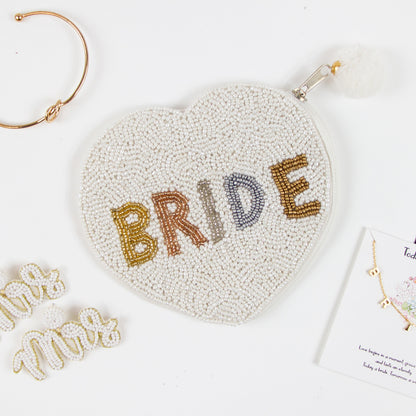 Elegant Bride Coin Purse featuring intricate hand-beaded design. This bridal clutch, made of durable canvas, presents a beautiful contrast of matte white beading and gold shine. Perfect for weddings, it offers a secure zipper to keep belongings safe. Measuring compactly, it's both stylish and functional, allowing brides to carry their essentials with grace. Each purse is uniquely crafted, ensuring a one-of-a-kind accessory for any special occasion