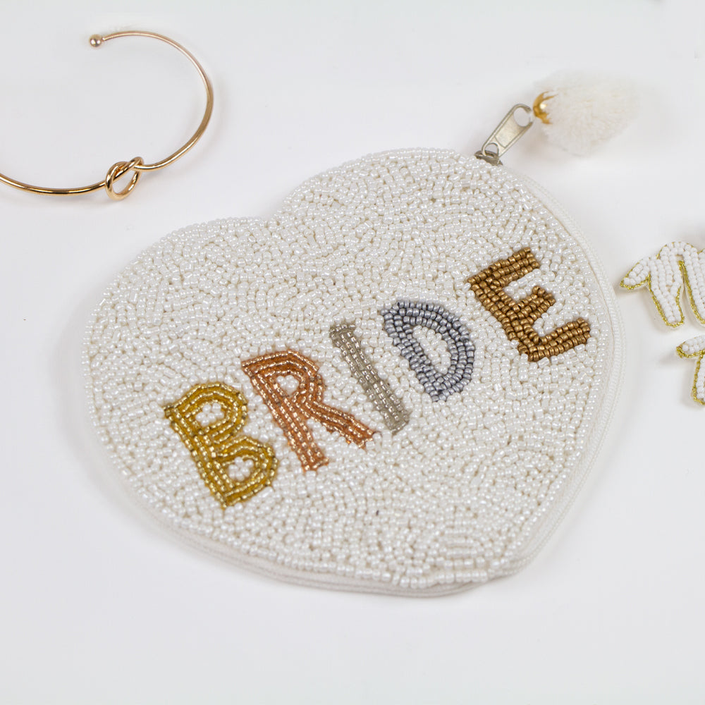 Elegant Bride Coin Purse featuring intricate hand-beaded design. This bridal clutch, made of durable canvas, presents a beautiful contrast of matte white beading and gold shine. Perfect for weddings, it offers a secure zipper to keep belongings safe. Measuring compactly, it's both stylish and functional, allowing brides to carry their essentials with grace. Each purse is uniquely crafted, ensuring a one-of-a-kind accessory for any special occasion