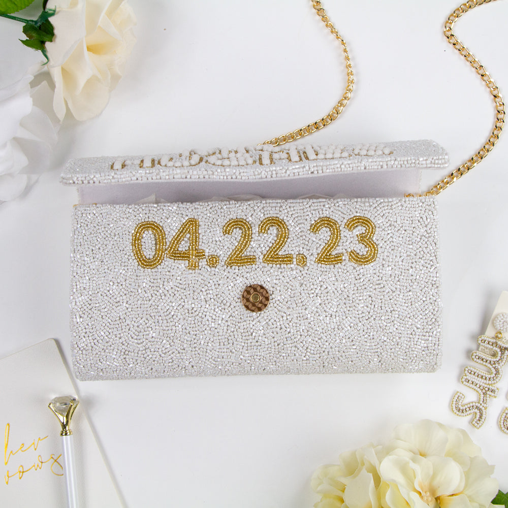 Elegant Bridal Clutch: Custom Gold Pearl Beaded Clutch Purse measuring 9.5in x 5in x 3in. Handcrafted to perfection, this bridal accessory adds a touch of sophistication to any ensemble. Each clutch is uniquely designed, ensuring brides have a one-of-a-kind accessory for their special day