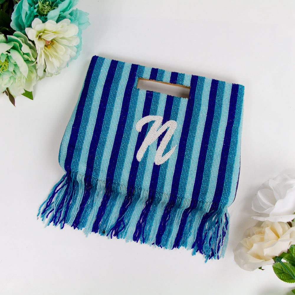 Handcrafted Custom Bridal Fringe Purse with intricate beading pattern, ideal for weddings, birthdays, and special occasions. Each unique clutch is a testament to artisanal craftsmanship, ensuring a one-of-a-kind accessory