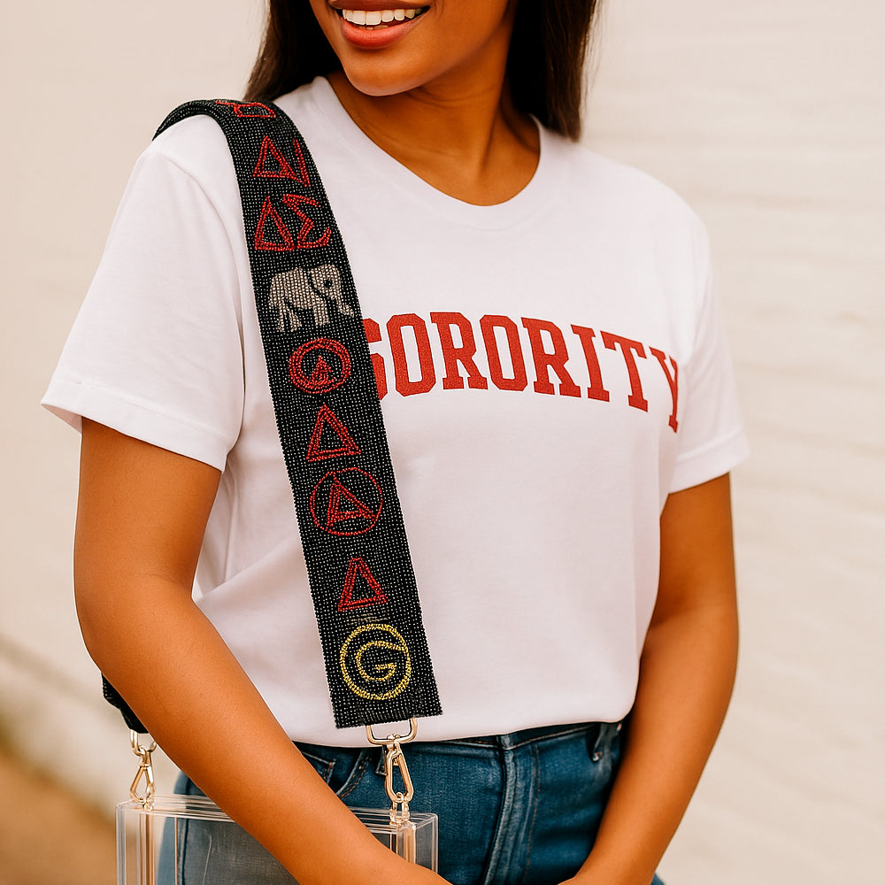 a woman wearing a white shirt and a black and red belt