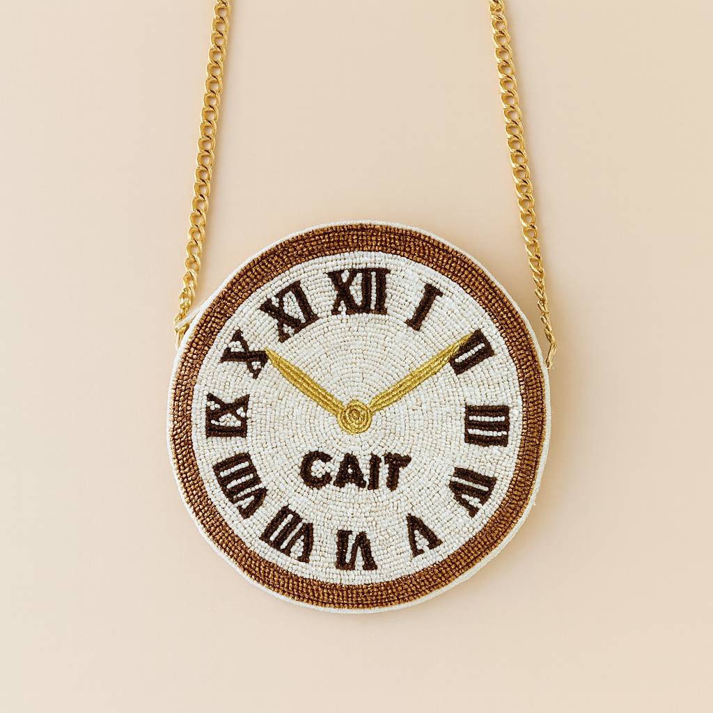 A round, beaded clock with Roman numerals and gold hands is suspended from a chain.