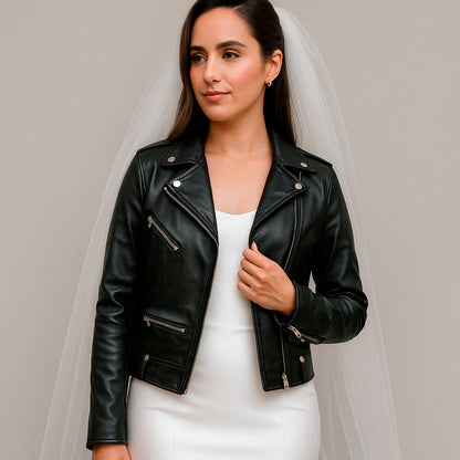 a woman in a white dress and a black leather jacket