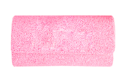 a roll of pink tissue on a white background