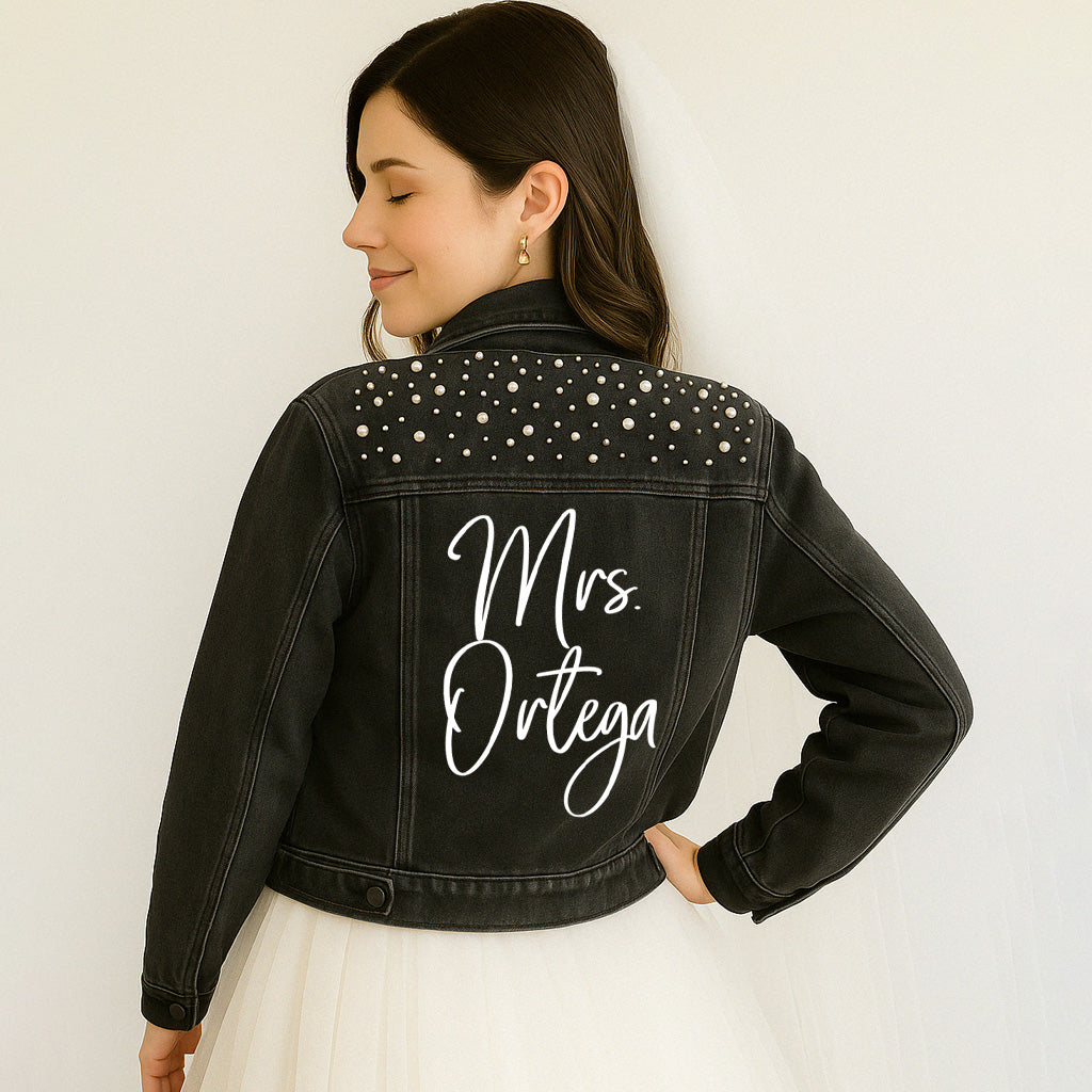 a woman in a white dress and a black jean jacket
