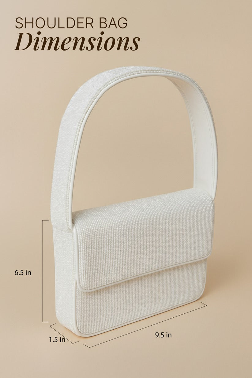 a white shoulder bag with dimensions provided in inches.