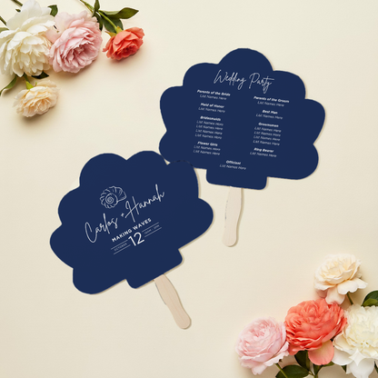 two blue fan-shaped cards with text on them, placed on a white background with pink and white flowers.