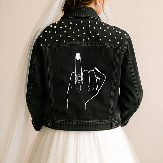 a woman wearing a black jean jacket with a finger on it