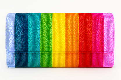 a rainbow colored clutch bag on a white background