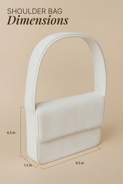 a white shoulder bag with dimensions provided in inches.