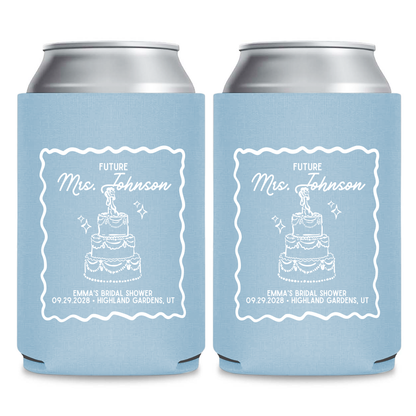 two blue can holders with white text and graphics, likely intended for a bridal shower.