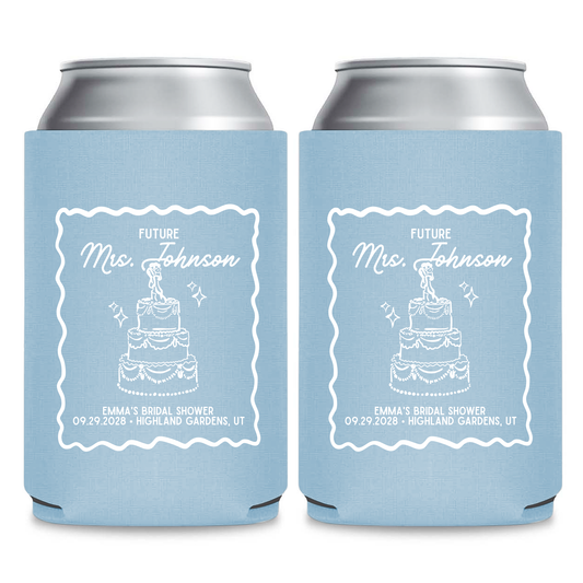 two blue can holders with white text and graphics, likely intended for a bridal shower.