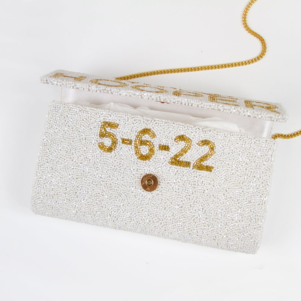 Unique Bridal Clutch: Custom Mrs Clutch Purse with Photo (FOG) showcasing detailed beadwork and a personal photo touch. Expertly handcrafted, this bridal clutch measures 9.5in x 5in x 3in, fitting all your wedding day essentials. With customizable options like a gold or silver chain and an inside date, it's the ideal blend of personalization and elegance. Perfect for brides looking for a one-of-a-kind accessory or as a memorable gift for a special bride-to-be