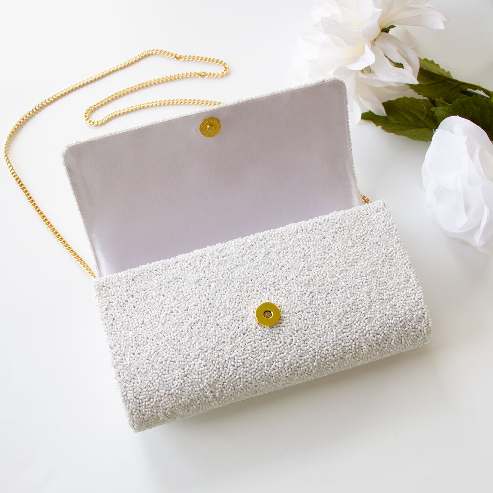 Unique Bridal Clutch: Custom Mrs Clutch Purse with Photo (FOG) showcasing detailed beadwork and a personal photo touch. Expertly handcrafted, this bridal clutch measures 9.5in x 5in x 3in, fitting all your wedding day essentials. With customizable options like a gold or silver chain and an inside date, it's the ideal blend of personalization and elegance. Perfect for brides looking for a one-of-a-kind accessory or as a memorable gift for a special bride-to-be