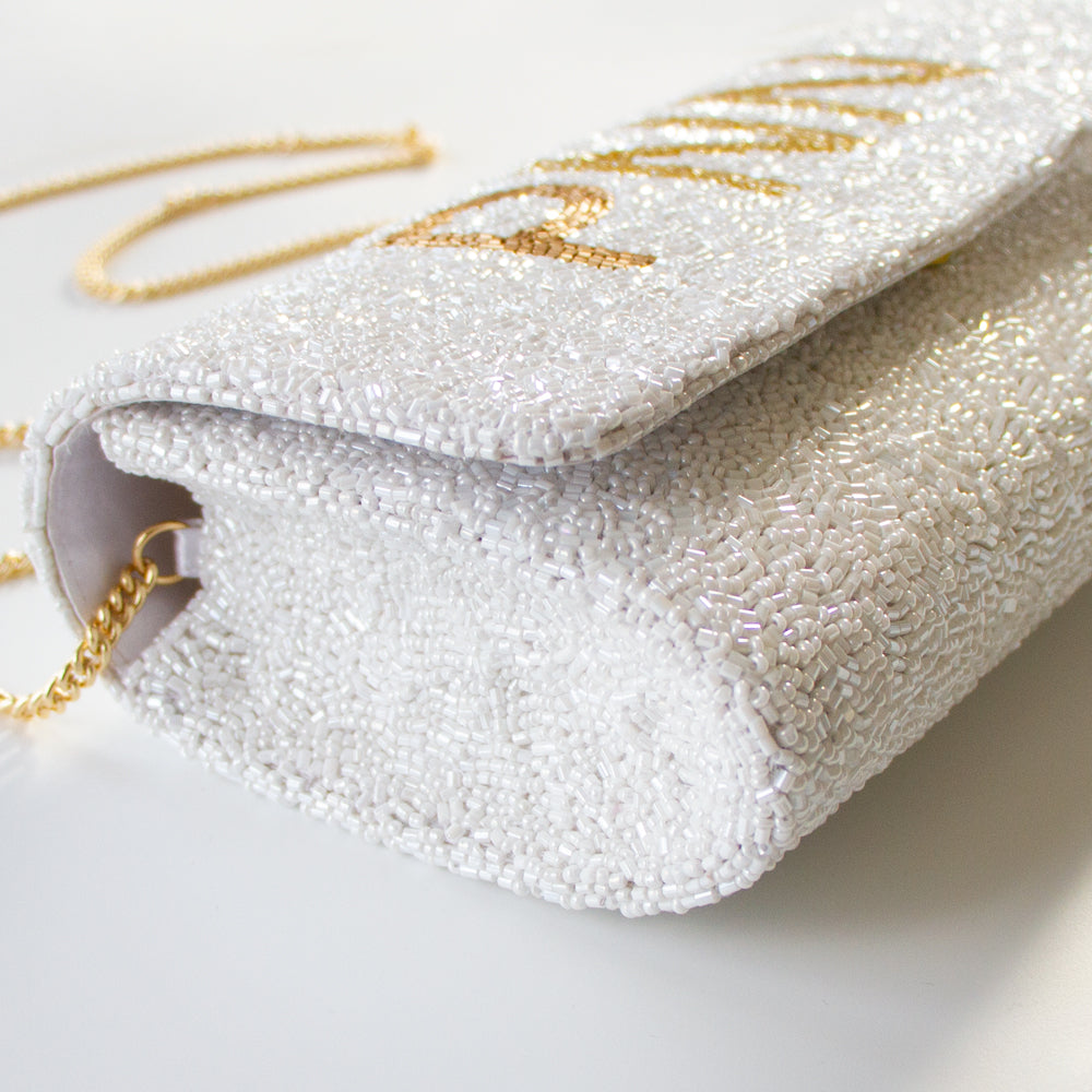 Unique Bridal Clutch: Custom Mrs Clutch Purse with Photo (FOG) showcasing detailed beadwork and a personal photo touch. Expertly handcrafted, this bridal clutch measures 9.5in x 5in x 3in, fitting all your wedding day essentials. With customizable options like a gold or silver chain and an inside date, it's the ideal blend of personalization and elegance. Perfect for brides looking for a one-of-a-kind accessory or as a memorable gift for a special bride-to-be