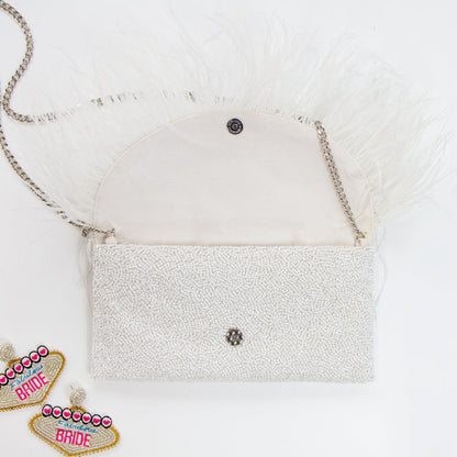 Elegant Custom Seed Bead Clutch Purse with Feather Style design, measuring 9" W x 5" H. Perfect for weddings, it offers a handcrafted intricate pattern and comes with an optional gold or silver chain. This unique, one-of-a-kind purse not only serves as a functional accessory but also a statement piece, with the ability to personalize with a custom date inside.