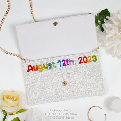 Handcrafted Custom Mrs Last Name Rainbow Bridal Clutch Bag (LHFC) with white text beading, ideal for holding wedding essentials.