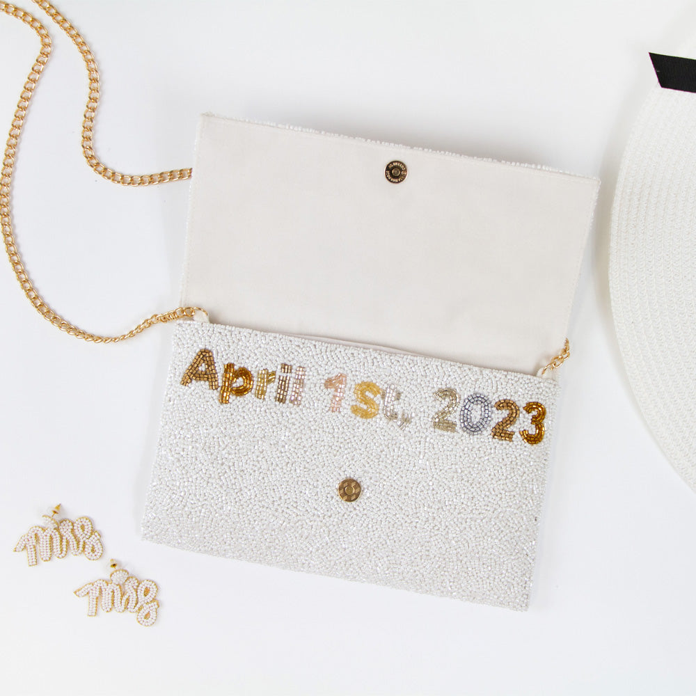 Chic Bridal Clutch: Personalized Seed Bead Clutch Purse for Brides, measuring 9 1/2″ wide x 5″ tall. Handcrafted with a velvet interior, this clutch offers both style and functionality for brides. Every handmade clutch is uniquely designed, making it an exquisite accessory for the special day.