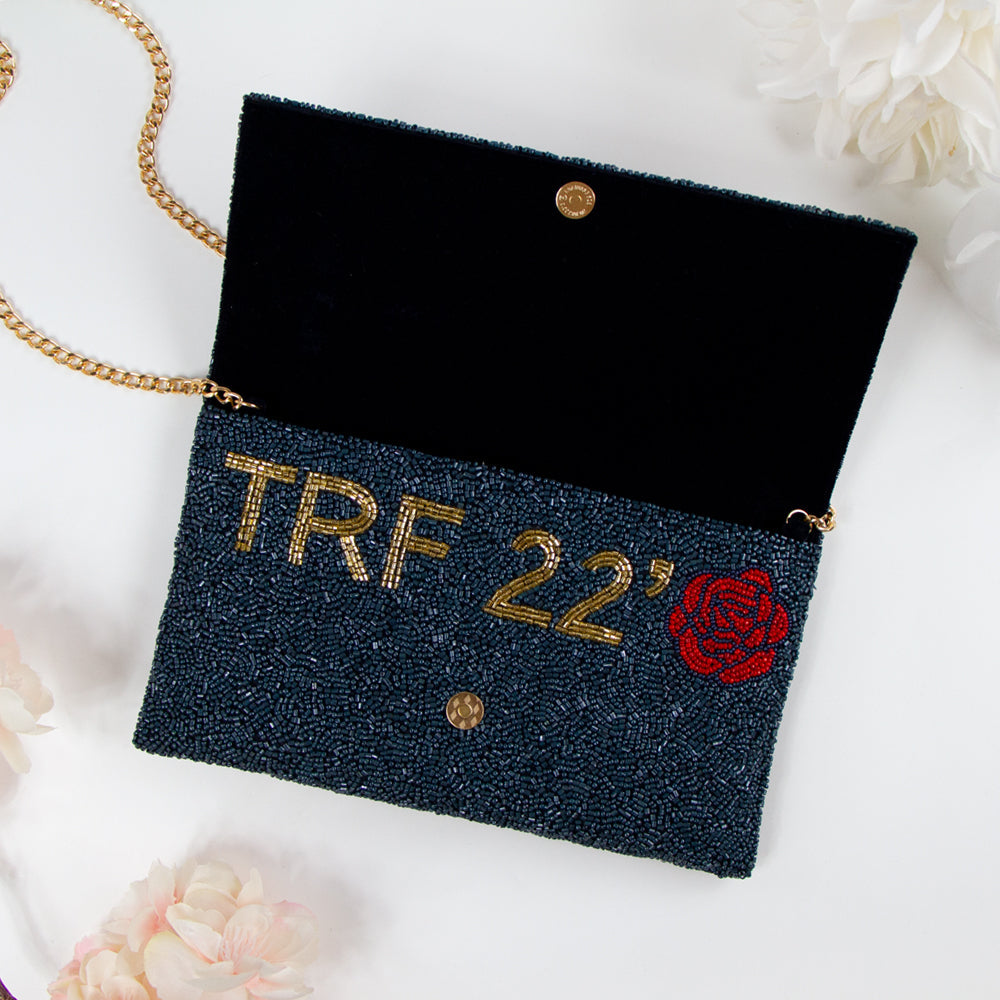 Handmade Custom Design Clutch (LHFC) with rainbow beading and white text, perfect for weddings and special events. Features gold or silver chain and unique beaded patterns, ideal for brides seeking a one-of-a-kind bridal clutch