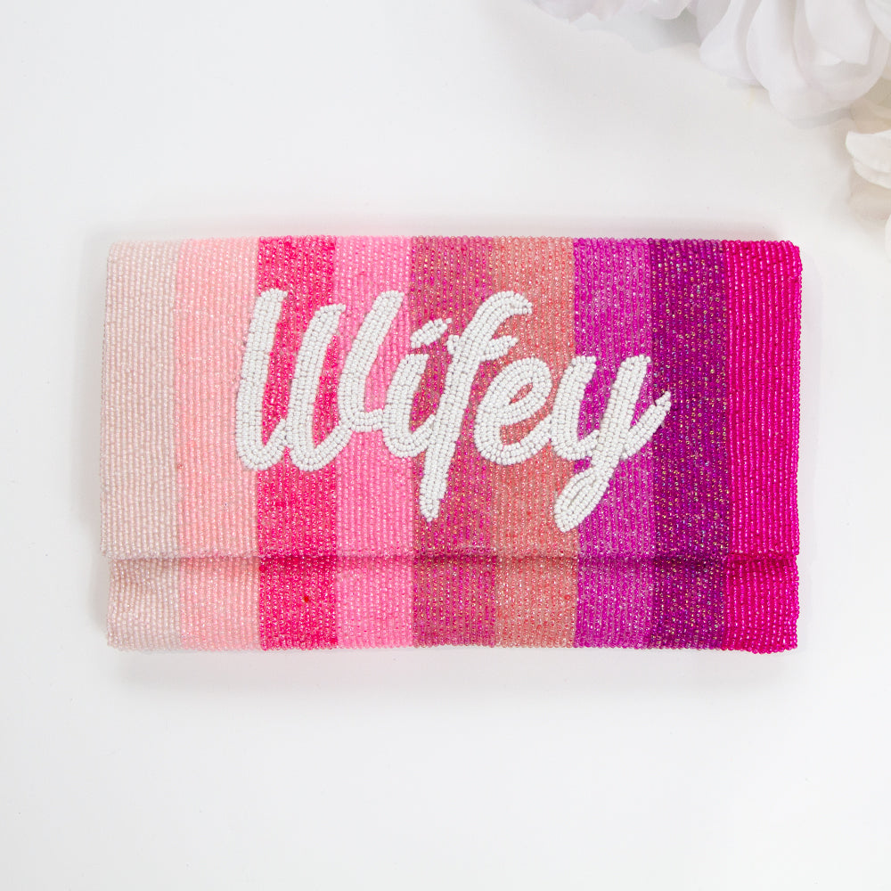 Exquisite Bridal Clutch: Custom Monogram Clutch Purse measuring 9 1/2″ wide x 5″ tall. Featuring rainbow clutch design with white text beading, complemented by a velvet interior. Each handmade clutch is unique, ideal for brides desiring a personalized touch on their special day