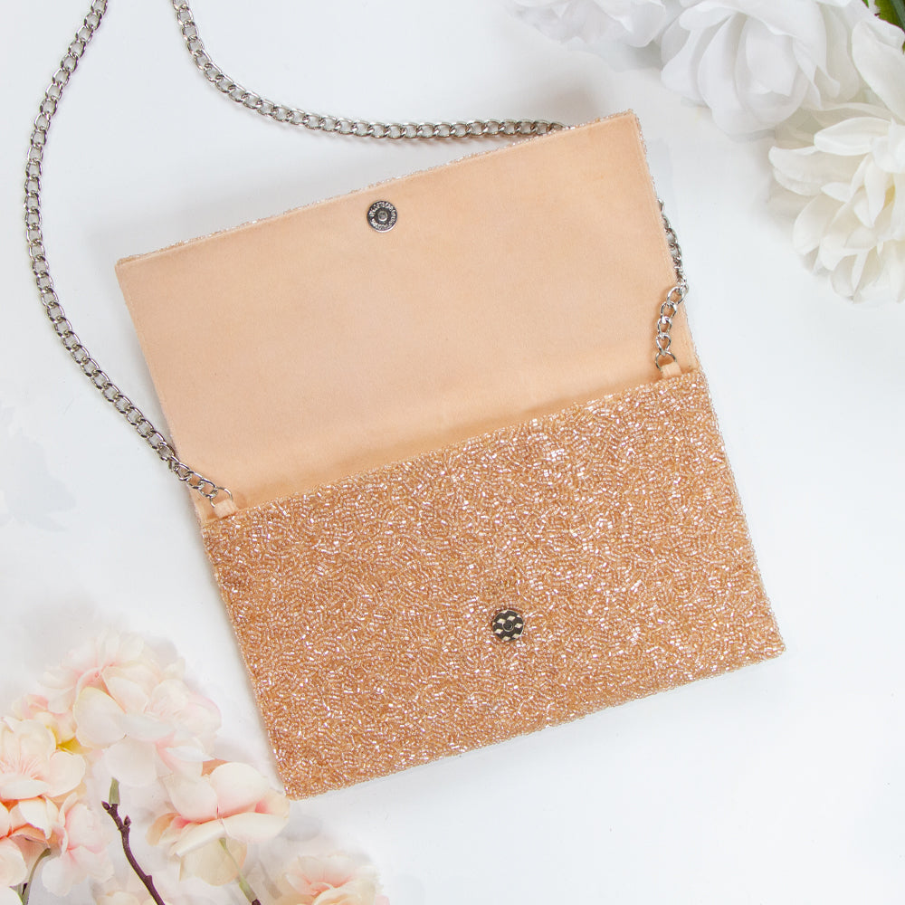 Chic Bridal Clutch: Personalized Seed Bead Clutch Purse for Brides, measuring 9 1/2″ wide x 5″ tall. Handcrafted with a velvet interior, this clutch offers both style and functionality for brides. Every handmade clutch is uniquely designed, making it an exquisite accessory for the special day.