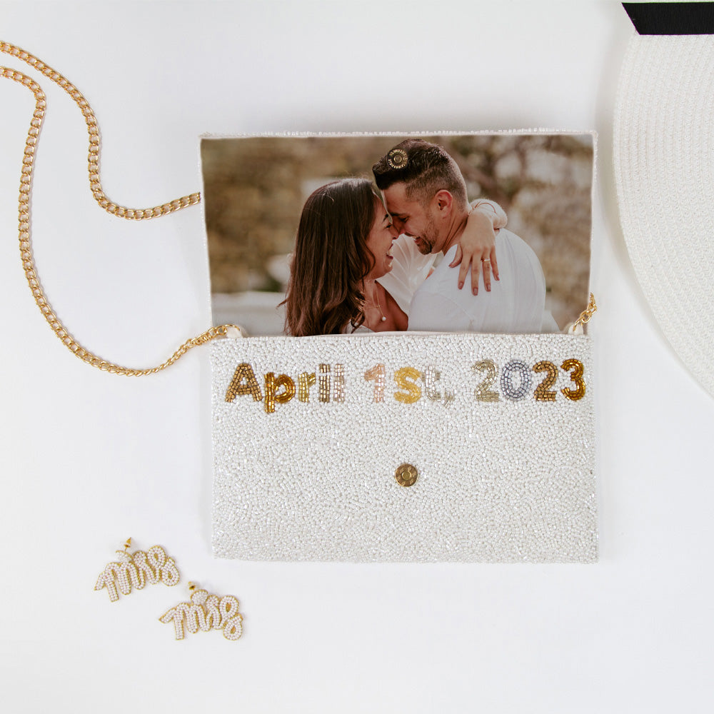 Handmade Custom Design Clutch (LHFC) with rainbow beading and white text, perfect for weddings and special events. Features gold or silver chain and unique beaded patterns, ideal for brides seeking a one-of-a-kind bridal clutch