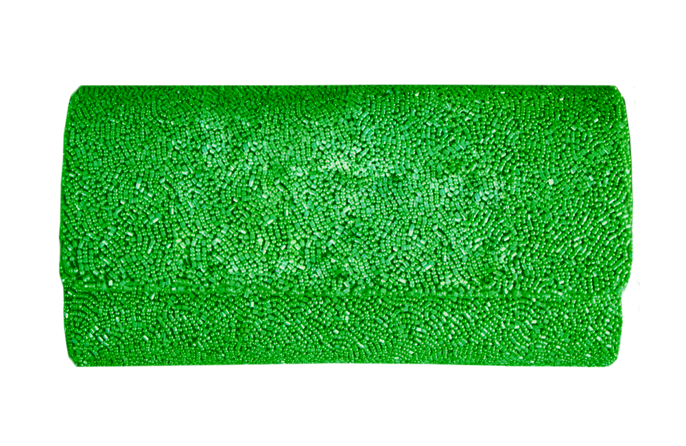 a roll of green glitter on a white background