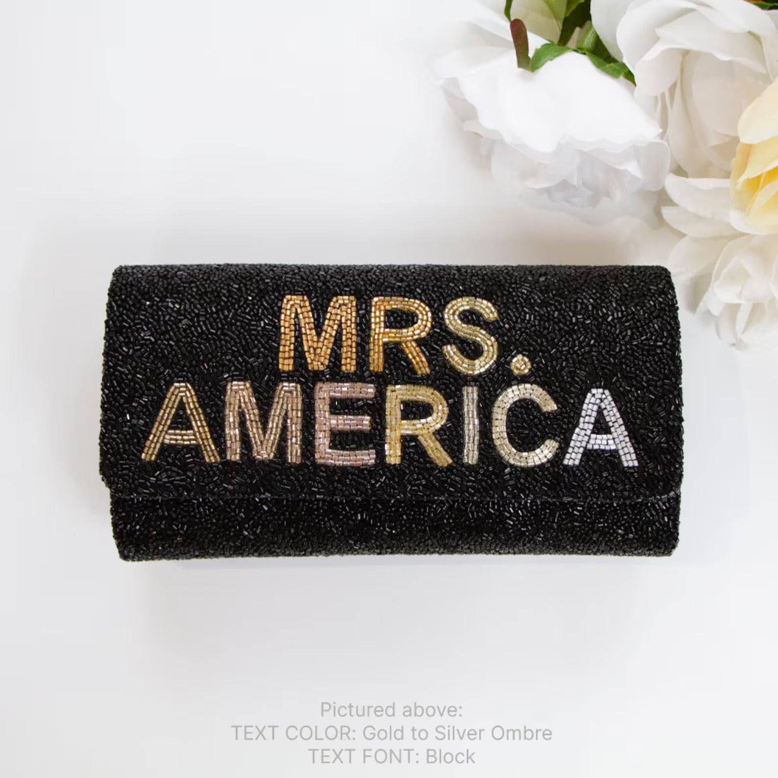 black bridal clutch with the design and logo of Mrs. America