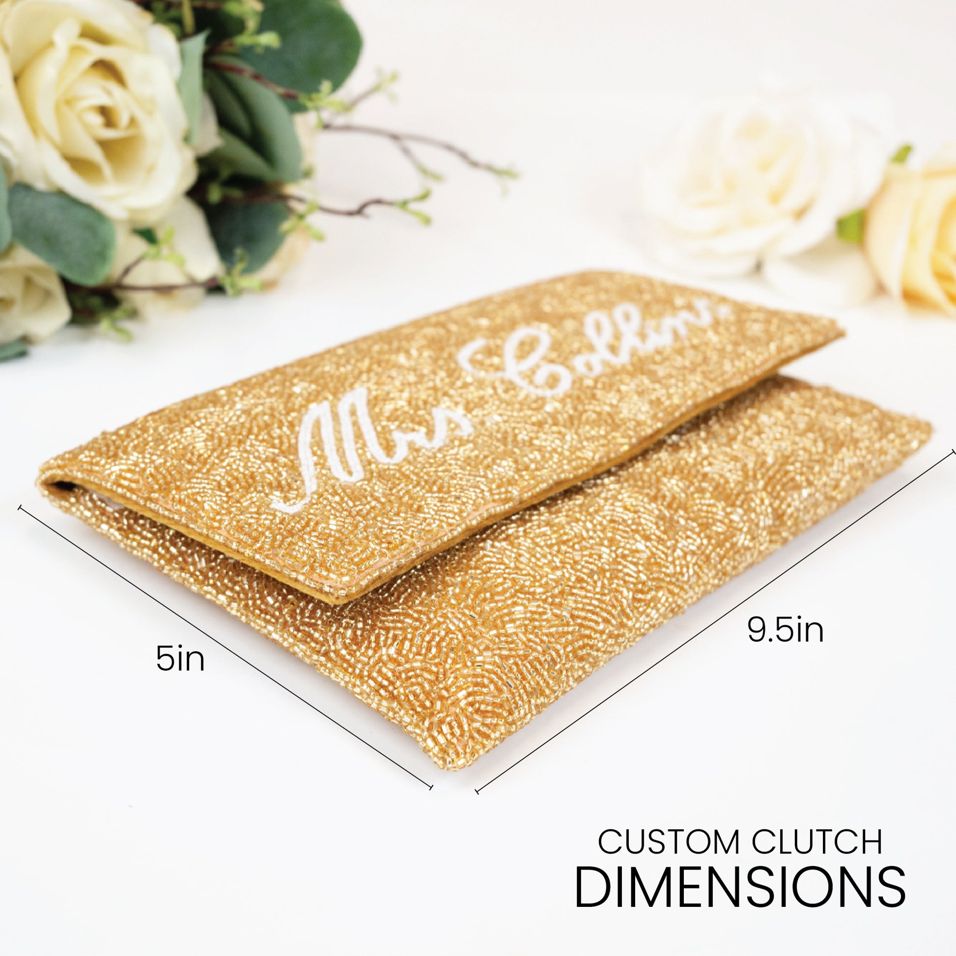 A gold clutch purse with the name "Mrs. Bollins" printed on it, along with measurements indicating it is 5 inches in length and 9.5 inches in width.