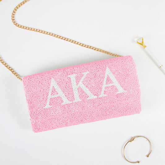 Elegant Personality Sorority Beaded Clutch Bag showcasing intricate beading patterns. Handcrafted to perfection, this clutch offers both style and function for weddings and special events. Features a customizable date inside, and an option for a gold or silver chain. Measuring at 9.5in x 5in x 3in, it's spacious enough for essentials while retaining a sophisticated silhouette. Each clutch celebrates unique craftsmanship, ensuring every piece is a one-of-a-kind accessory."