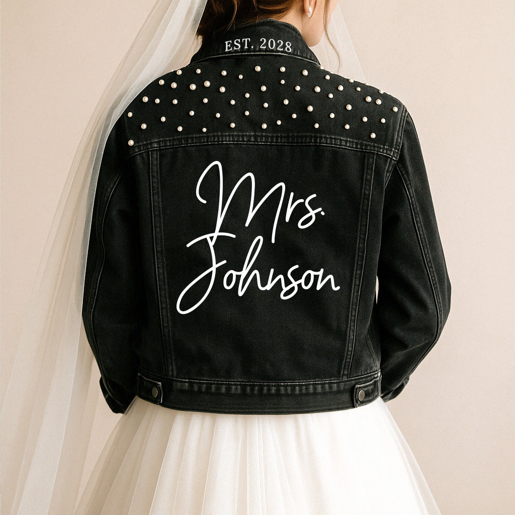 a woman wearing a black jacket with a bride's name on it