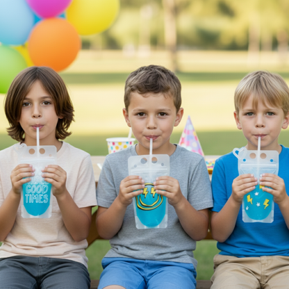Three young boys sitting on a bench, each holding a drink in a clear cup with a straw. The background includes colorful balloons, suggesting a festive atmosphere.