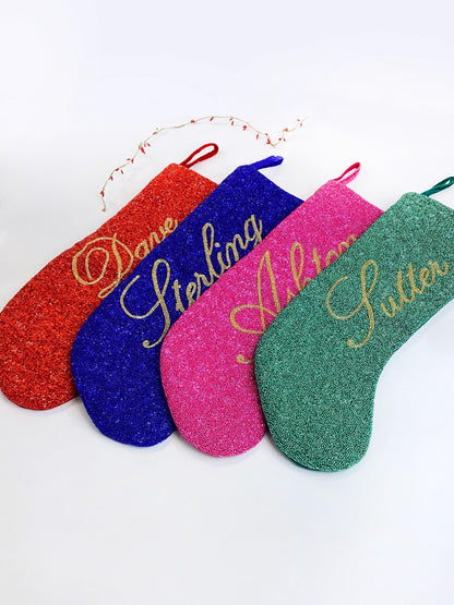 a set of four personalized oven mitts