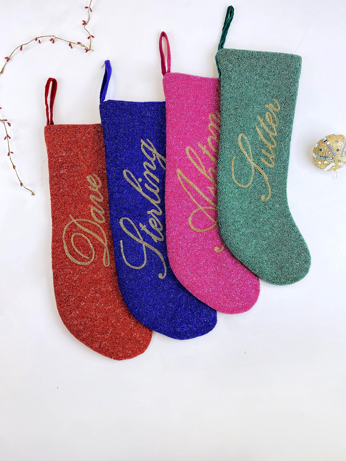 a group of three christmas stockings hanging from a string