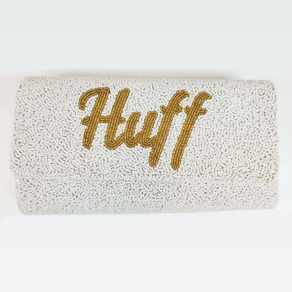 "Elegant Bridal Clutch: Custom Name Seed Bead Bachelorette Clutch Purse measuring 9.5in x 5in x 3in with the option of a gold or silver chain. Perfectly handcrafted with intricate beading patterns, this clutch ensures every bride has a unique and classy accessory for her special day. Inside customization available for a personal touch