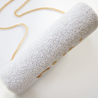 "Elegant Bridal Clutch: Custom Name Seed Bead Bachelorette Clutch Purse measuring 9.5in x 5in x 3in with the option of a gold or silver chain. Perfectly handcrafted with intricate beading patterns, this clutch ensures every bride has a unique and classy accessory for her special day. Inside customization available for a personal touch