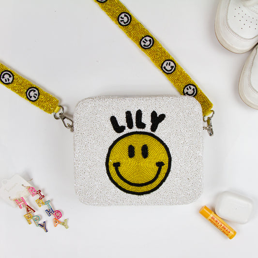 Chic Customized Smiley Beaded Crossbody Bag, measuring 8in x 8in x 2in, is a standout accessory for both daytime and evening wear. Handcrafted with unique beading, this bag offers a personalized touch with its customizable design. Featuring a 46in removable crossbody strap and secure zipper closure, this one-of-a-kind purse is not only stylish but also functional, making it an ideal gift option for loved ones.
