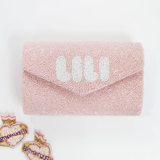 Charming Mini Envelope Wedding Clutch Purse (MIENV) measuring 9.25" W x 5" H, adorned with intricate beading. Ideal for brides or as a flower girl gift, this handcrafted purse provides a stylish complement to any outfit and can hold essential items for special occasions. Featuring customizable gold or silver chain options, it's a unique, bespoke accessory that stands out with its craftsmanship and individuality