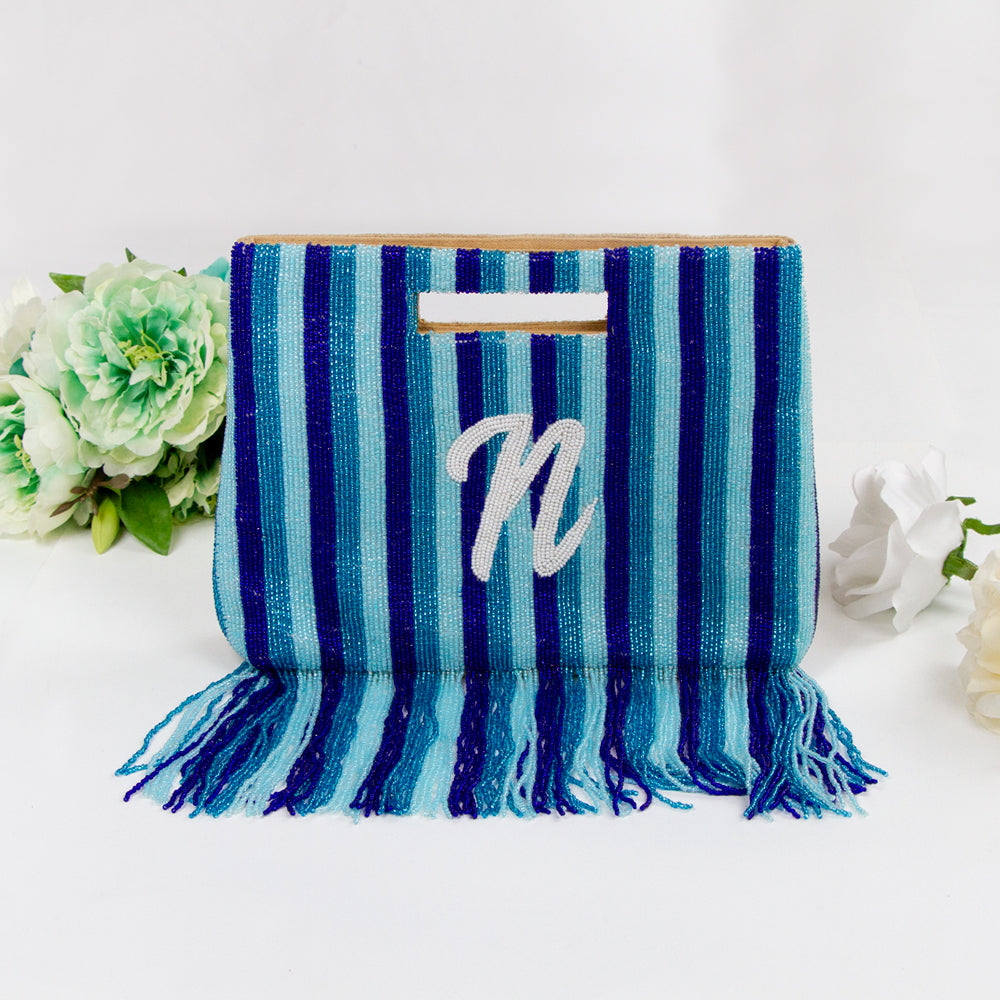 Handcrafted Custom Bridal Fringe Purse with intricate beading pattern, ideal for weddings, birthdays, and special occasions. Each unique clutch is a testament to artisanal craftsmanship, ensuring a one-of-a-kind accessory
