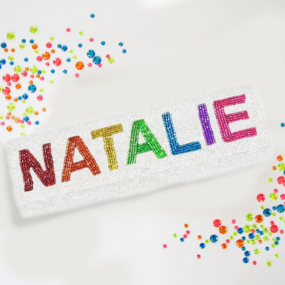 Stunning Personalized Half Barrel Rainbow Beaded Clutch Bag, boasting a vibrant array of colors. Crafted by hand, this wedding purse exhibits an intricate design, blending elegance and class. Measuring at 12″ wide x 3 1/2″ tall, it's a perfect size to hold essentials for special events. Complete with a choice of gold or silver chain, and the option to personalize with a date inside, it offers both style and functionality. Each piece, being handcrafted, promises a unique accessory to cherish and flaunt."